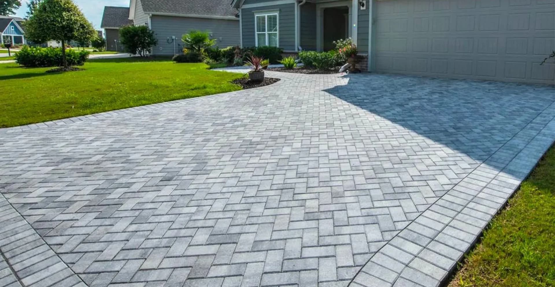 Wide interlocking driveway with contrasting stone borders